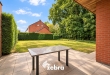 Ruime halfopen woning met 4 slaapkamers en westgerichte tuin in centrum Tielt!
