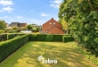 Ruime halfopen woning met 4 slaapkamers en westgerichte tuin in centrum Tielt!