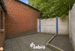 Te renoveren woning met 3 slaapkamers, kelder en zuidwestgerichte stadskoer in Tielt!