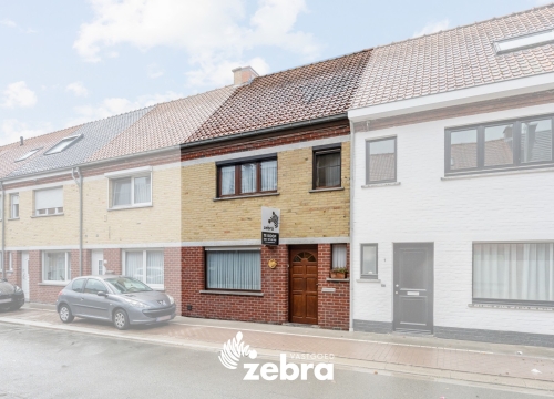 Op te frissen woning met zuidwestgerichte tuin en uitweg op een centrale ligging te Tielt!