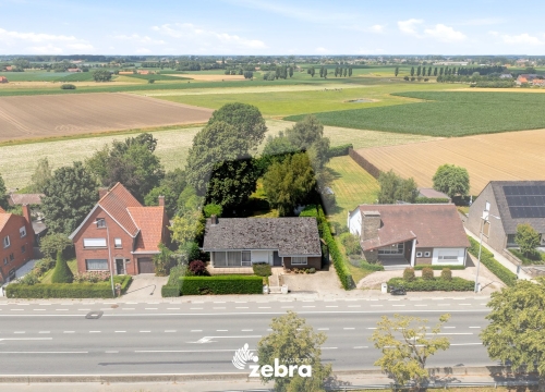 Te renoveren woning op een uitzonderlijk ruim perceel nabij het centrum van Tielt!