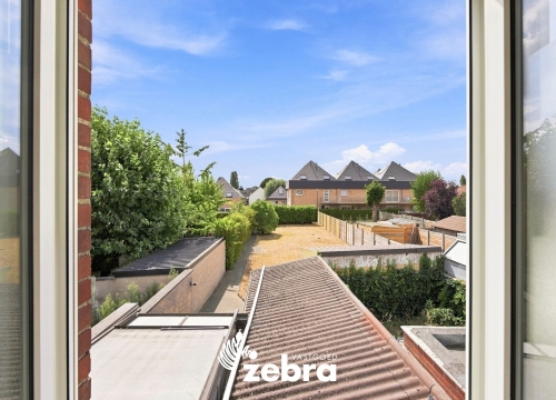 Op te frissen woning met 4 slaapkamers en ruime tuin met uitweg te Tielt!