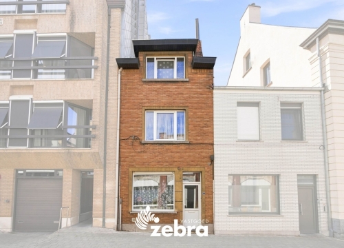 Te renoveren woning met 3 slaapkamers, kelder en zuidwestgerichte stadskoer in Tielt!